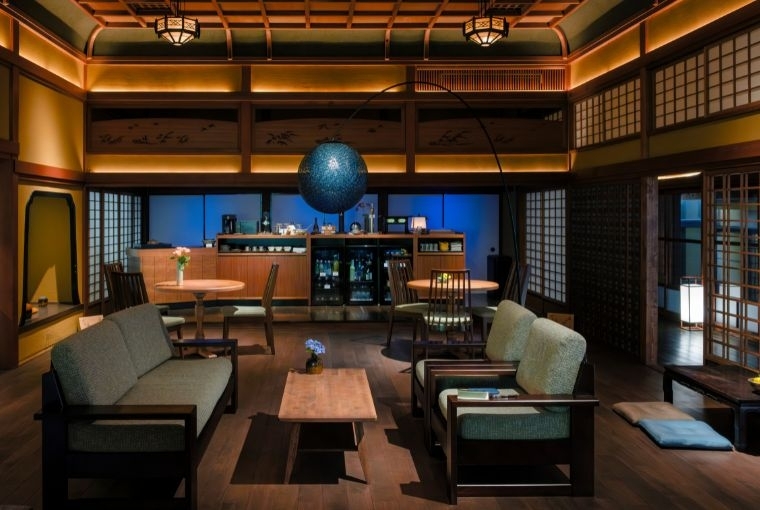 Quiet Luxury of Connection  At Ryokan Onomichi Nishiyama, the contemporary lounge offerings—set within a room that felt so distinctly Japanese—became a place where we met others as strangers and sat down as friends.