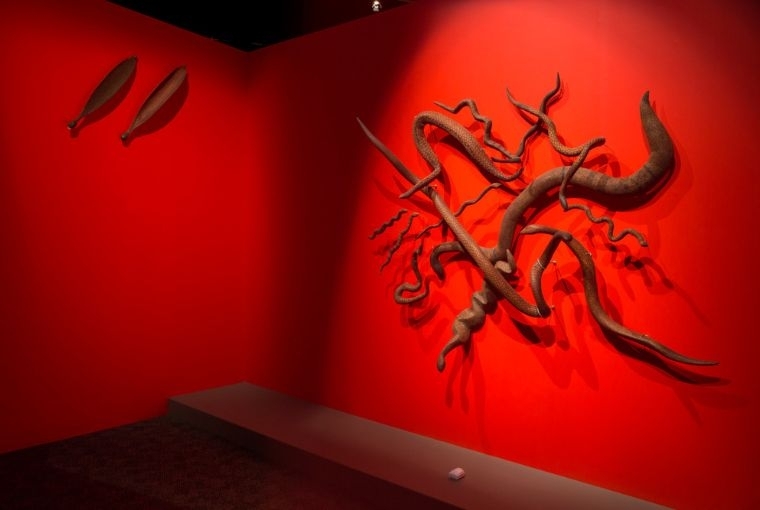 Songlines: Tracking the Seven Sisters Snake sculptures and mirru (spear throwers) 1982–92 by Ikula, Niningka Lewis, Mildred Nyunkiya Lyons, Nora, Jean Inyalanka Burke, Billy Cooley, Pulya Taylor, Nellie Nungarrayi Patterson, Tiger, Kangin